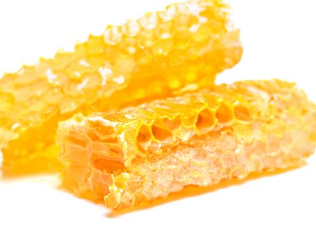 bee honeycomb with honey on a white background
