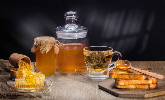 toasts with honey and tea in rustic style