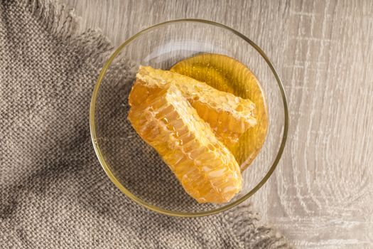 honeycomb with honey on the plate in a rustic style