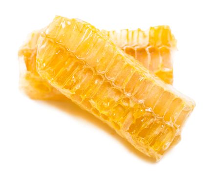 bee honeycomb with honey on a white background
