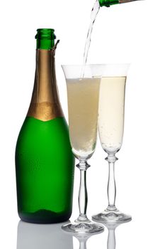 bottle and glasses of champagne on a white background