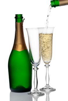 bottle and glasses of champagne on a white background