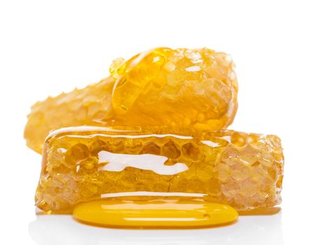 bee honeycomb with honey on a white background