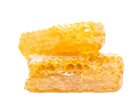 bee honeycomb with honey on a white background