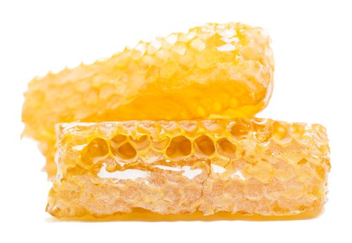 bee honeycomb with honey on a white background