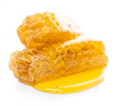 bee honeycomb with honey on a white background