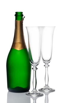 bottle of champagne and glasses on a white background