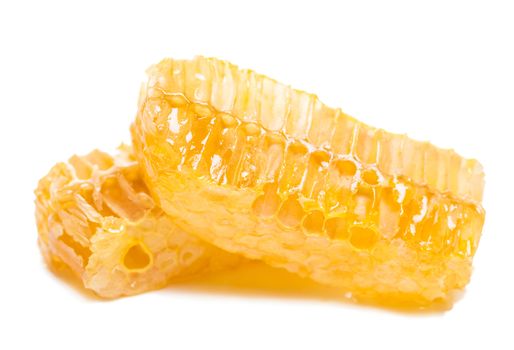 bee honeycomb with honey on a white background
