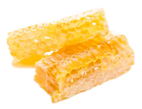 bee honeycomb with honey on a white background
