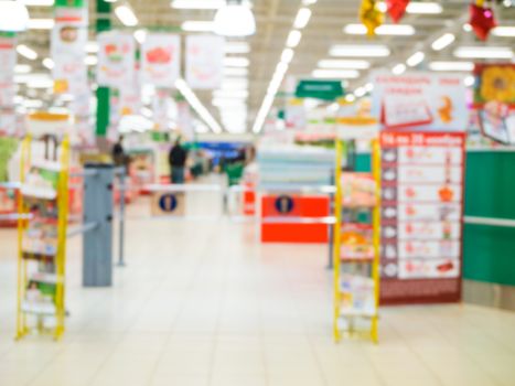 Abstract blurred entrance area of supermarket as background