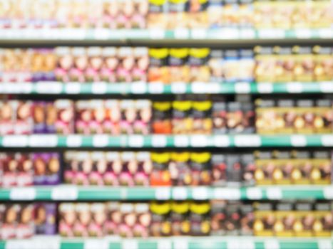Abstract blurred supermarket colorful shelves with hair-dye as background