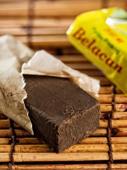 close up of a brick of belacan shrimp paste