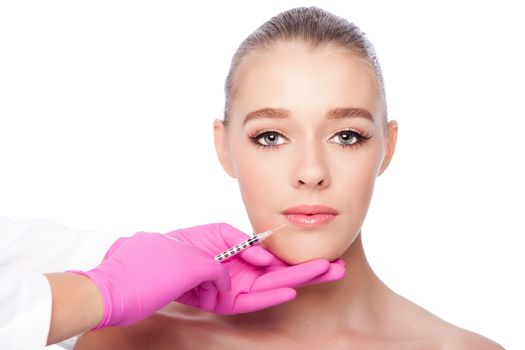 Beautiful face lip filler collagen injection Cosmetic spa beauty treatment with pink gloves, on white.