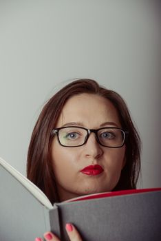 Business woman holding a wide open book