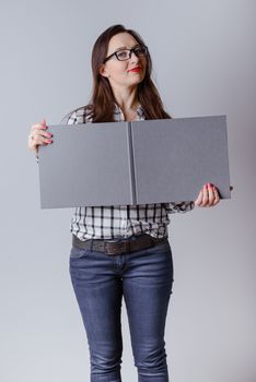 Business woman holding a wide open book