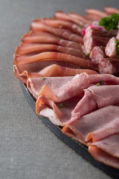 Assortment of meat delicatessen on a plate