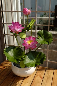 Artificial flower, handmade lotus flower with green leaf and pink petal make from clay, diy art product for home decoration