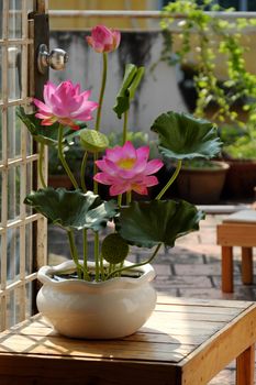 Artificial flower, handmade lotus flower with green leaf and pink petal make from clay, diy art product for home decoration