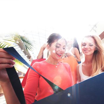 Beautiful young women shopping at mall