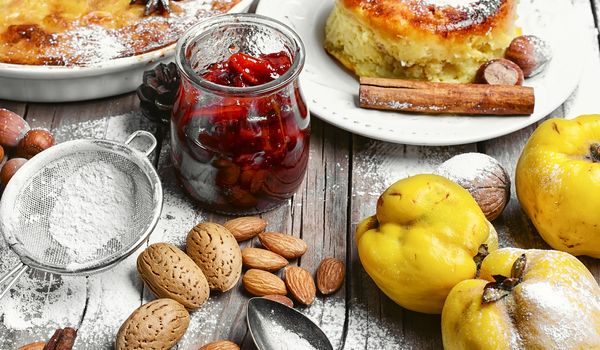 Baked sweet homemade cake with quince jam and rustic