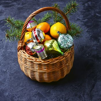 Wicker basket with vintage Christmas toys and gifts