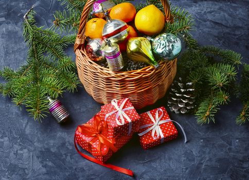 Wicker basket with vintage Christmas toys and gifts