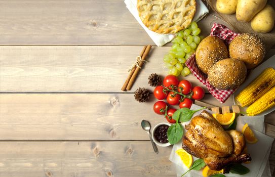 Savory and sweet food selection on top of a wooden background with copyspace 