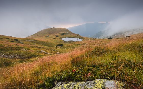 Foggy Mountain Landscape with a Tarn