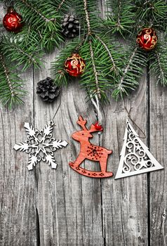 Spruce branches with pinecones and Christmas toy