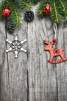 Spruce branches with pinecones and Christmas toy