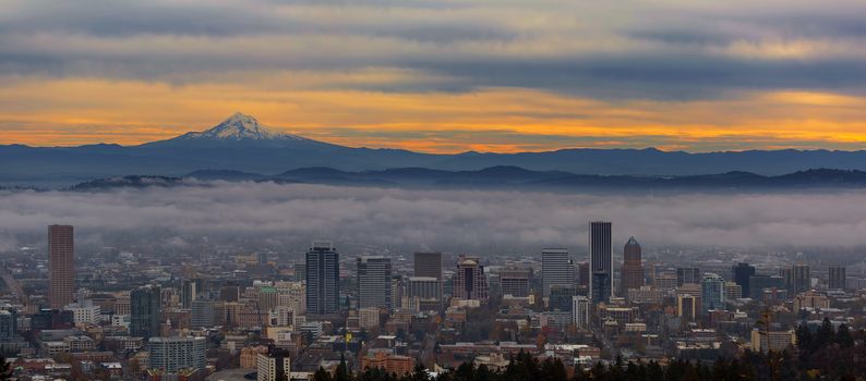 Foggy Portland Oregon downtown cityscape and Mount Hood during sunrise panorama