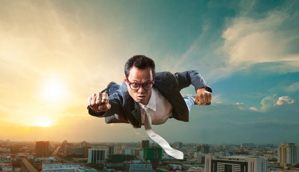 business man flying over skyscraper for business successful and competition concept