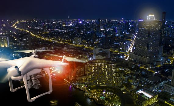 aerial view of using drone to take a photography of skyscraper at night 