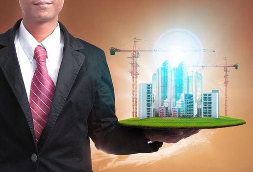 business man and high building construction project  for real estate and land development business