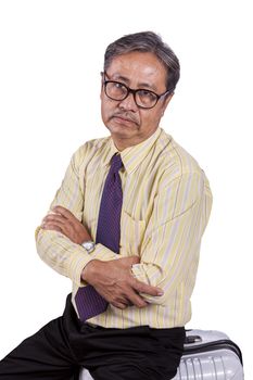 head shot of asian business man sitting on traveling luggage with bored face isolated white background