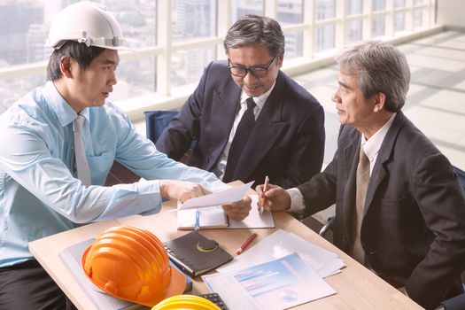 engineering man and senior architecture team project meeting in working office 