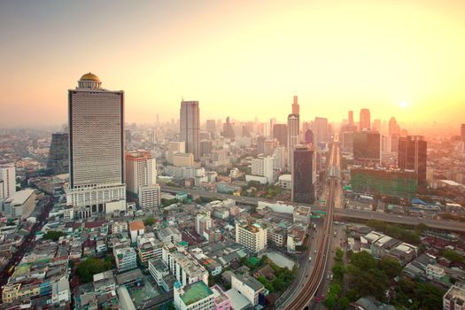 beautiful city scape urban scene  of bangkok capital of thailand in morning light glow up view from peak of sky scrapper building 