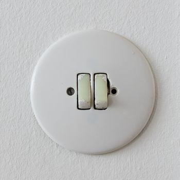 Electrical light wall switch, round and old