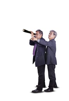 couples of asian business man spying by telescope lens for business strategy conceptual isolated white background