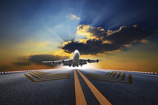 big passenger plane flying over airport runway against beautiful dusky sky use for air transport and traveling business 