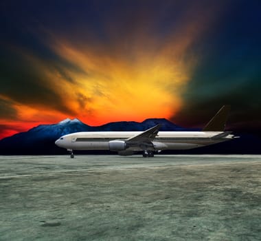 jet plane flying over runways and beautiful dusky sky with copy space use for air transport ,journey and traveling industry business 