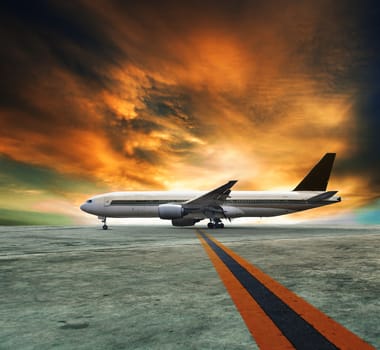 jet plane flying over runways and beautiful dusky sky with copy space use for air transport ,journey and traveling industry business 