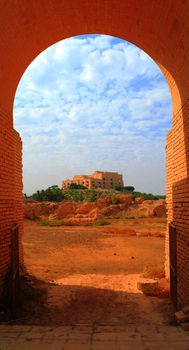 Former Saddam Hussein Palace in Babylon, view through Babylonian ruins arch , Iraq