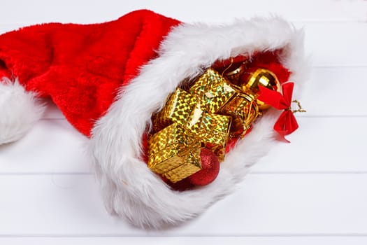 Christmas hat with Christmas decorations on white
