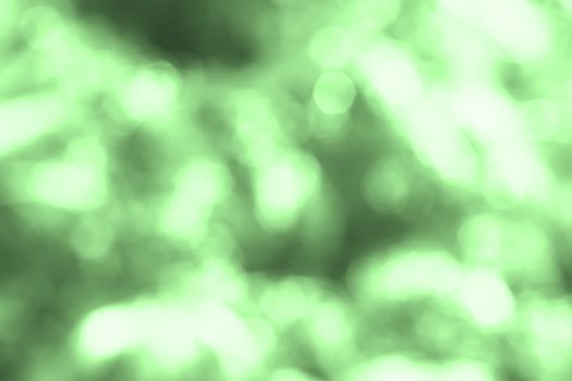 Green bokeh color light background, abstract blurred