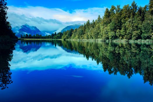 reflection scenic of lake matheson in south island new zealand