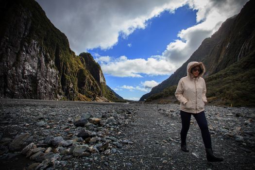 trekker in franz josef glacier new zealand