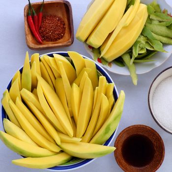 Vietnamese fruit, green mango cut in slice, a popular tropical fruit, rich vitamin A, vitamin C, collagen, good for health and impulse calcium absorption