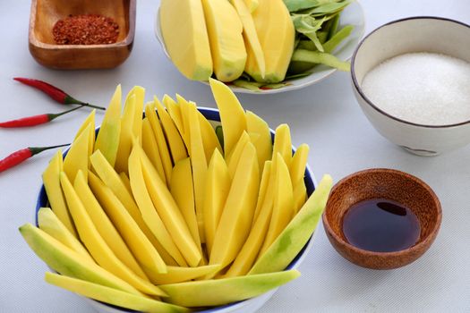 Vietnamese fruit, green mango cut in slice, a popular tropical fruit, rich vitamin A, vitamin C, collagen, good for health and impulse calcium absorption