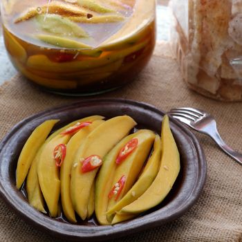 Vietnamese fruit, green mango cut in slice, a popular tropical fruit, rich vitamin A, vitamin C, collagen, good for health and impulse calcium absorption